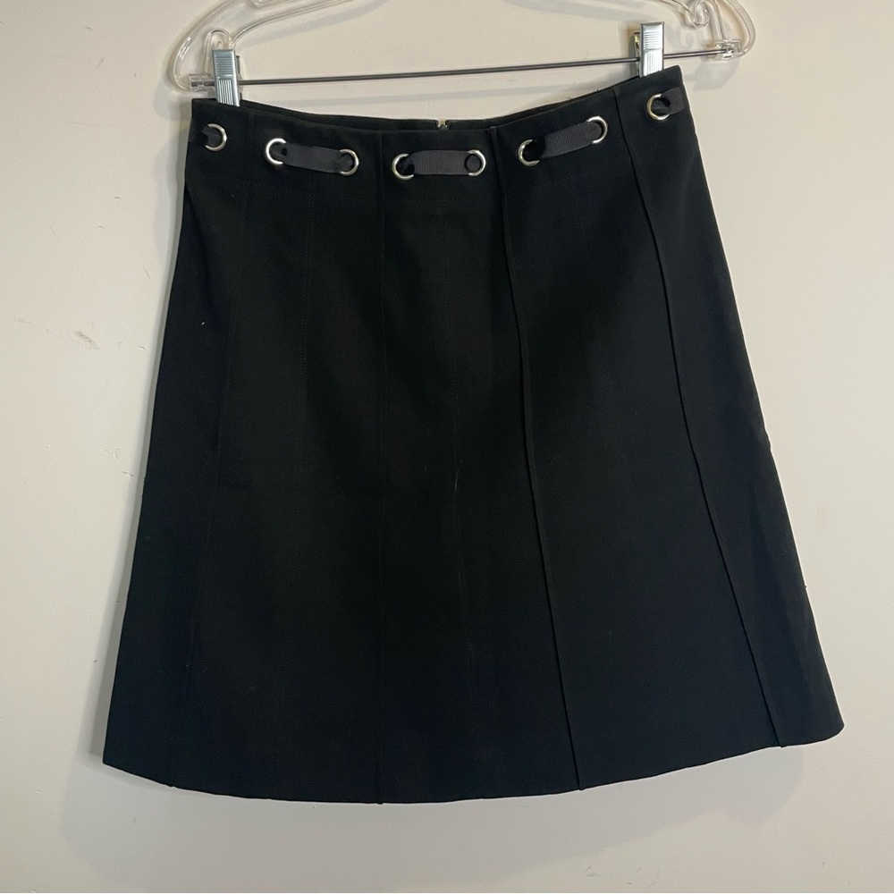 Gloria Gaudette black midi skirt with grommet eye ribbon waist detail
